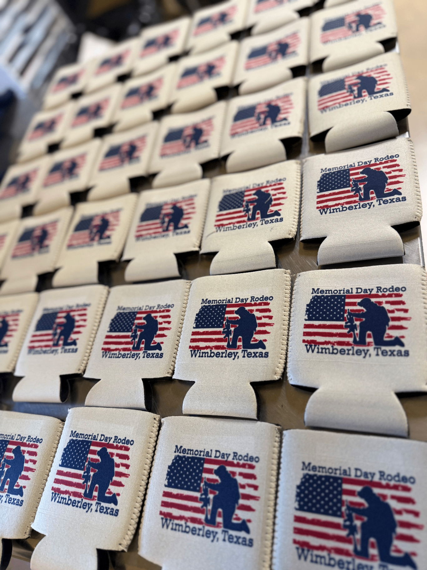 Custom promotional swag — pens, koozies, stickers